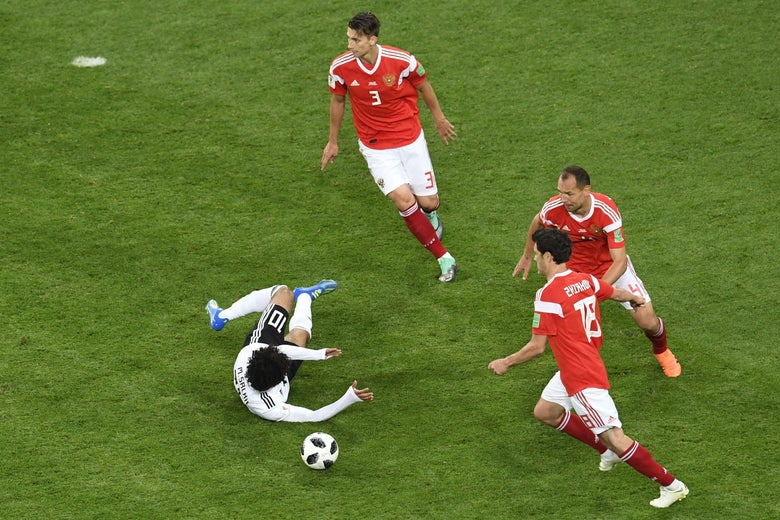 Egypt’s forward Mohamed Salah falls to the ground after being fouled during the World Cup.